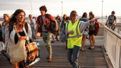 France orders evacuation of tourist spot as hundreds flee wildfires by boat